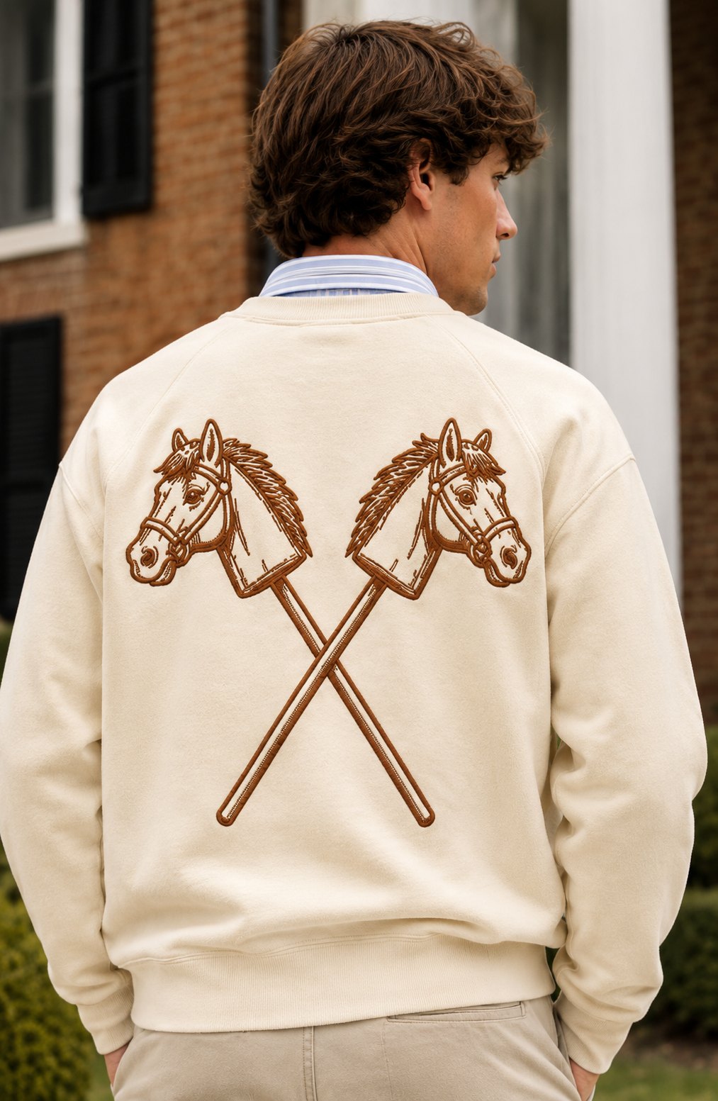 Back view of the cream crewneck with crossed hobby horses