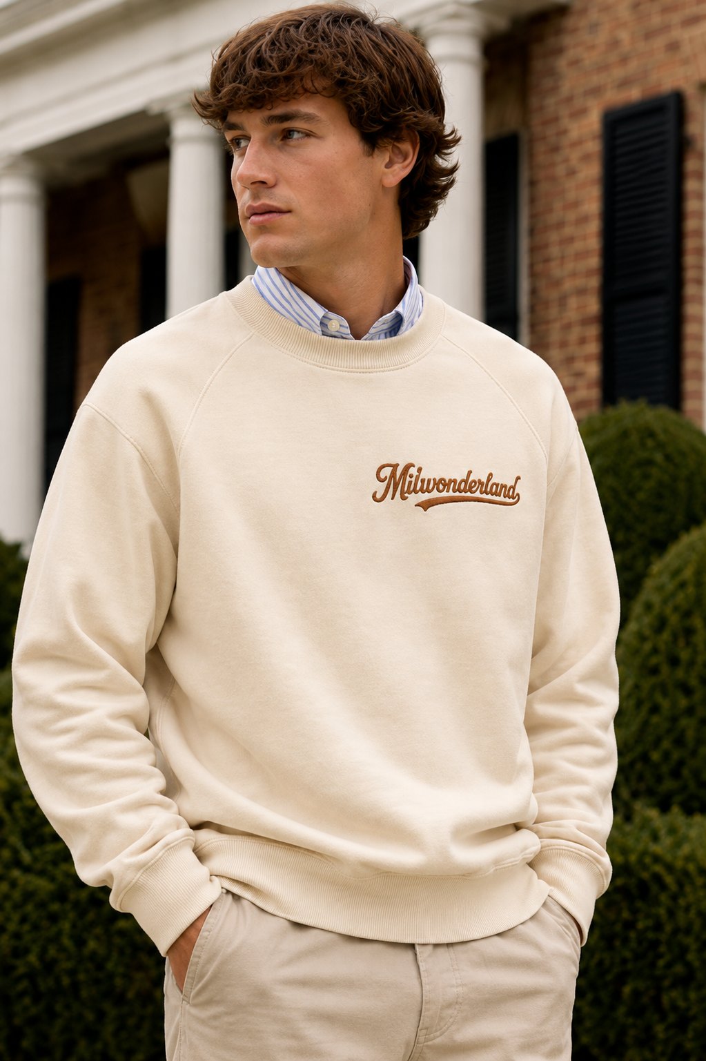 Man wearing the cream Milwonderland crewneck