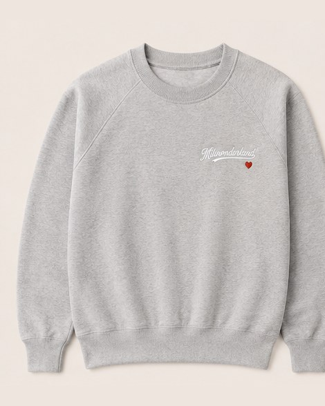 The grey heather crewneck laid flat, front.